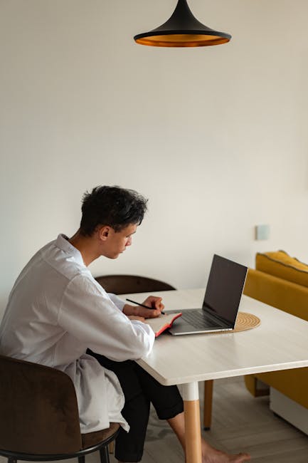 Person taking a break from work to do a light stretch in a bright room