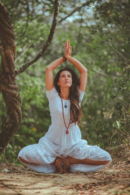 Woman practicing yoga outdoors, connecting with nature and finding peace